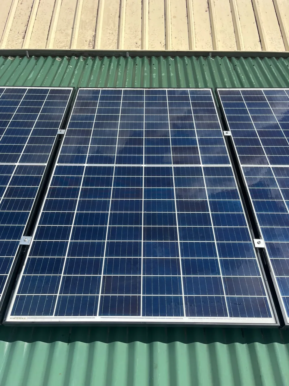 The same solar panel photographed from the same spot after the clean