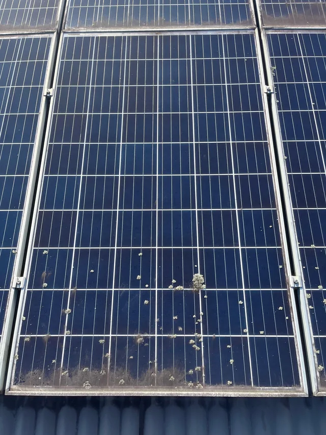 A solar panel with marks on the glass, photographed before the clean