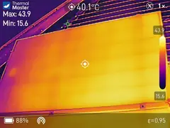 Thermal camera image of a whole solar panel, evenly warm, with no cell hotter than the rest