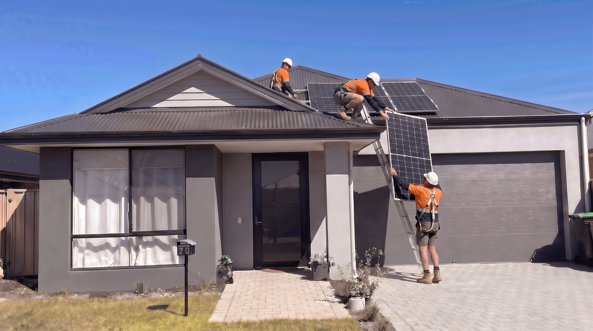 Couple in front of their solar-powered home