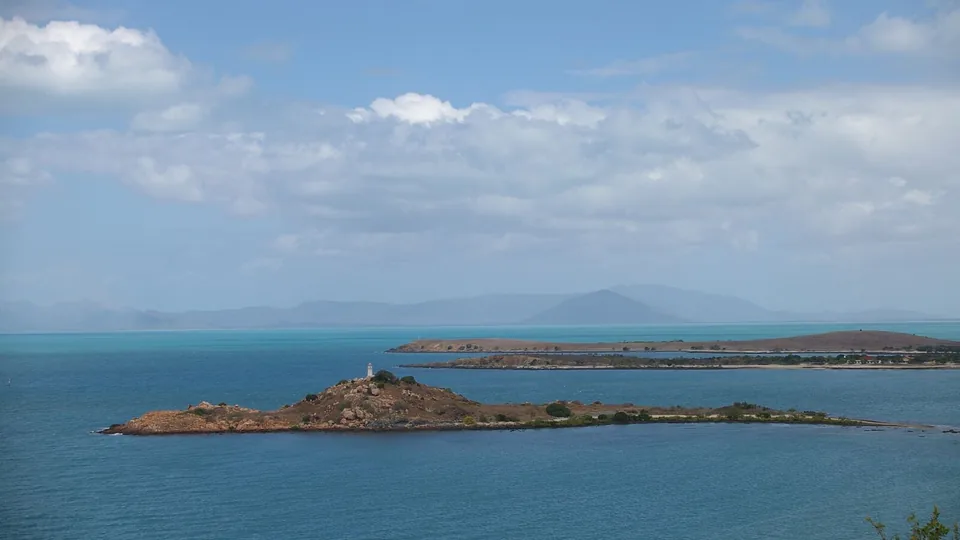 Small islands and a lighthouse off the Bowen coastline